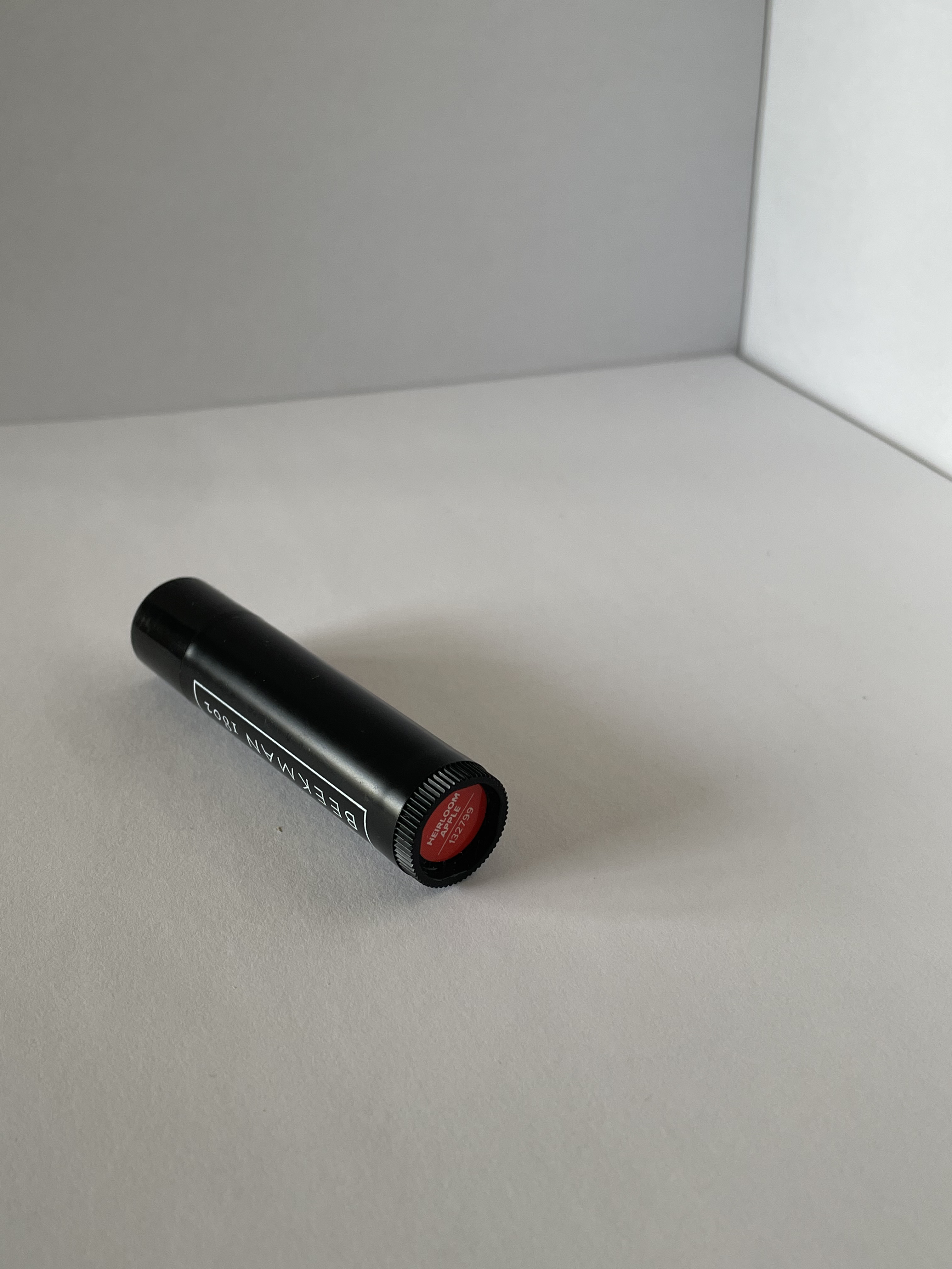 The bottom view of the lip balm.