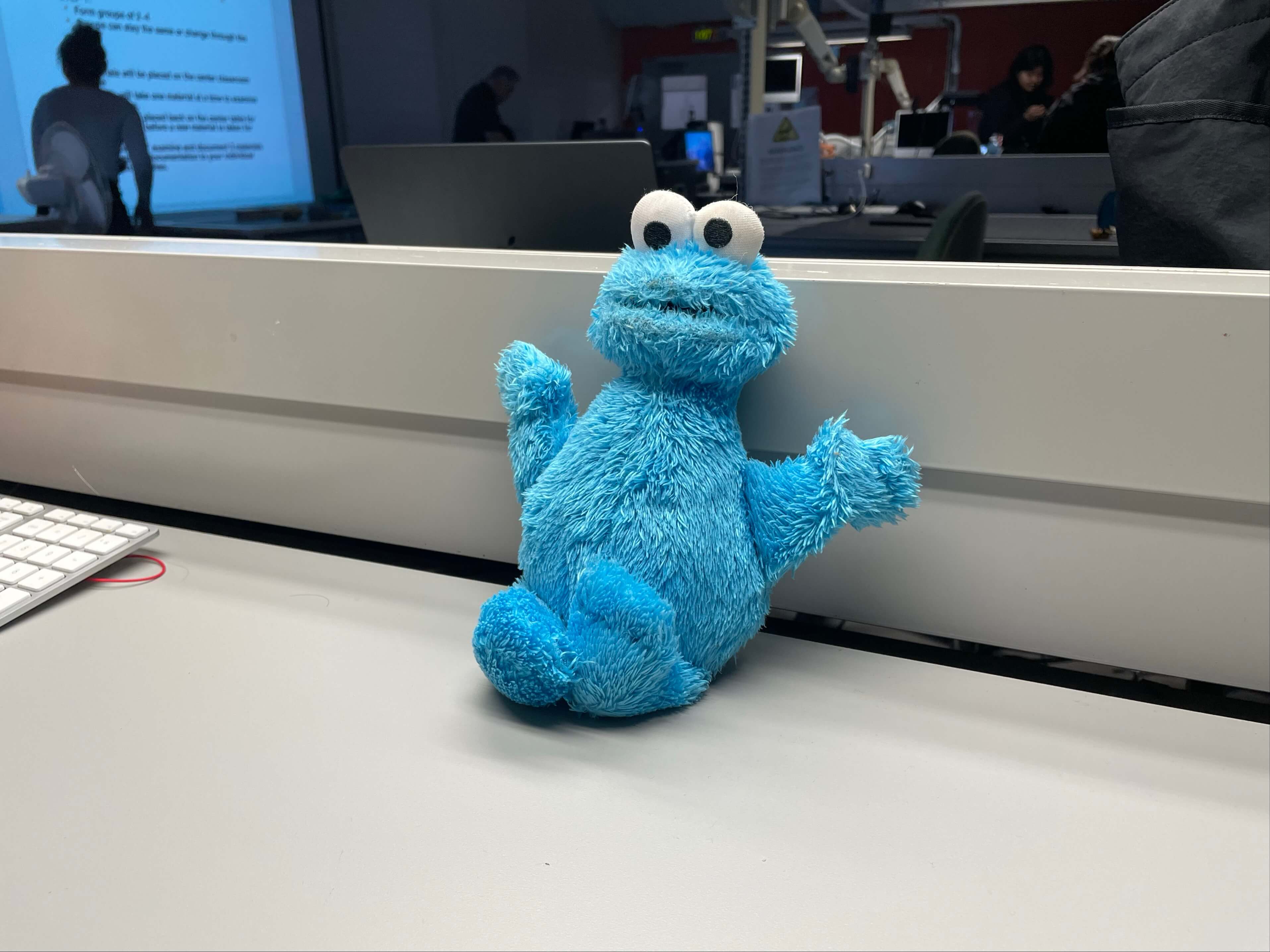 <ul><li>Material state: refined</li>
<li>Material plasticity: pliable</li>
<li>Material use: entertainment</li>
<li>Feels fluffy, soft</li>
<li>Blue, white, black</li></ul>
