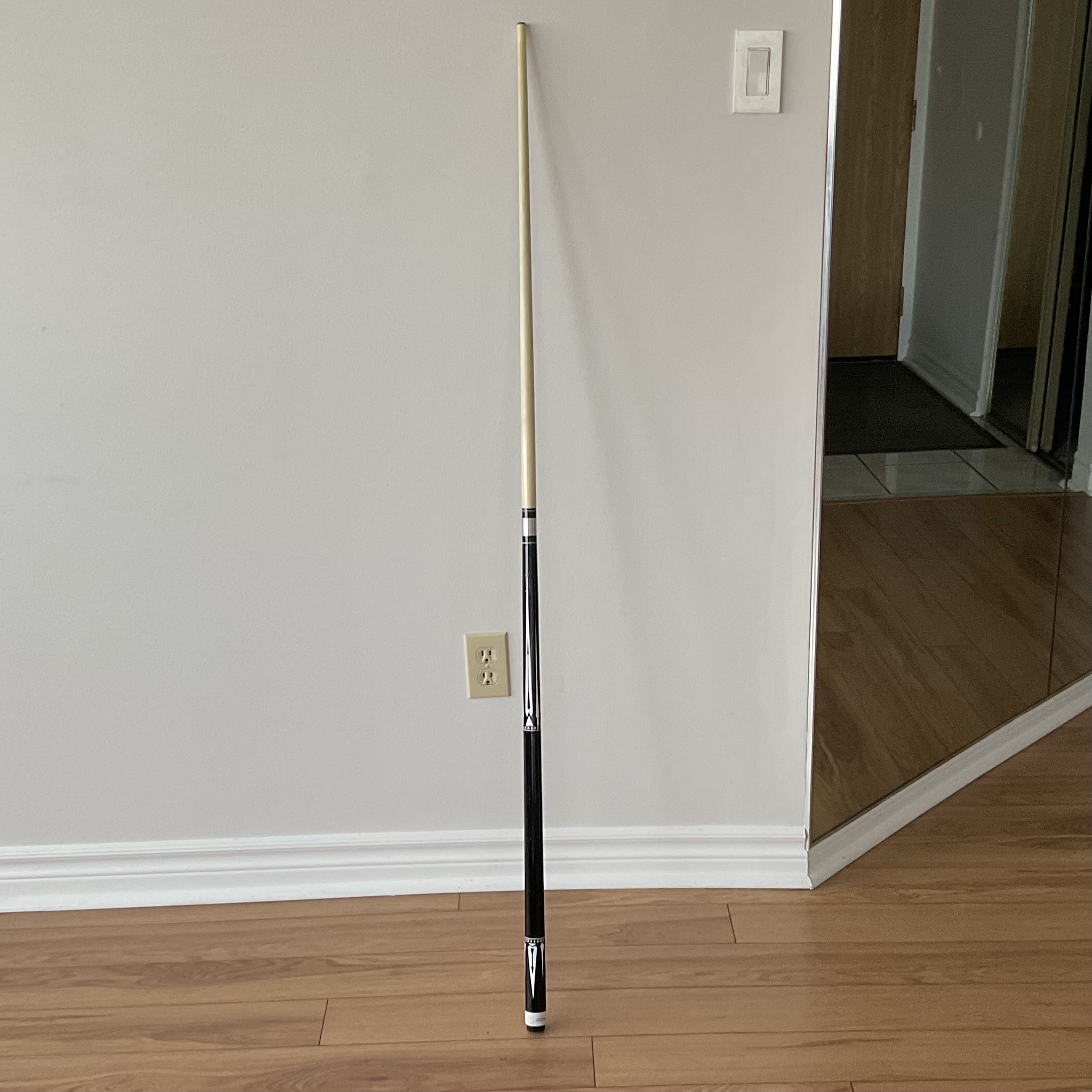The billards stick I often use to play pool.