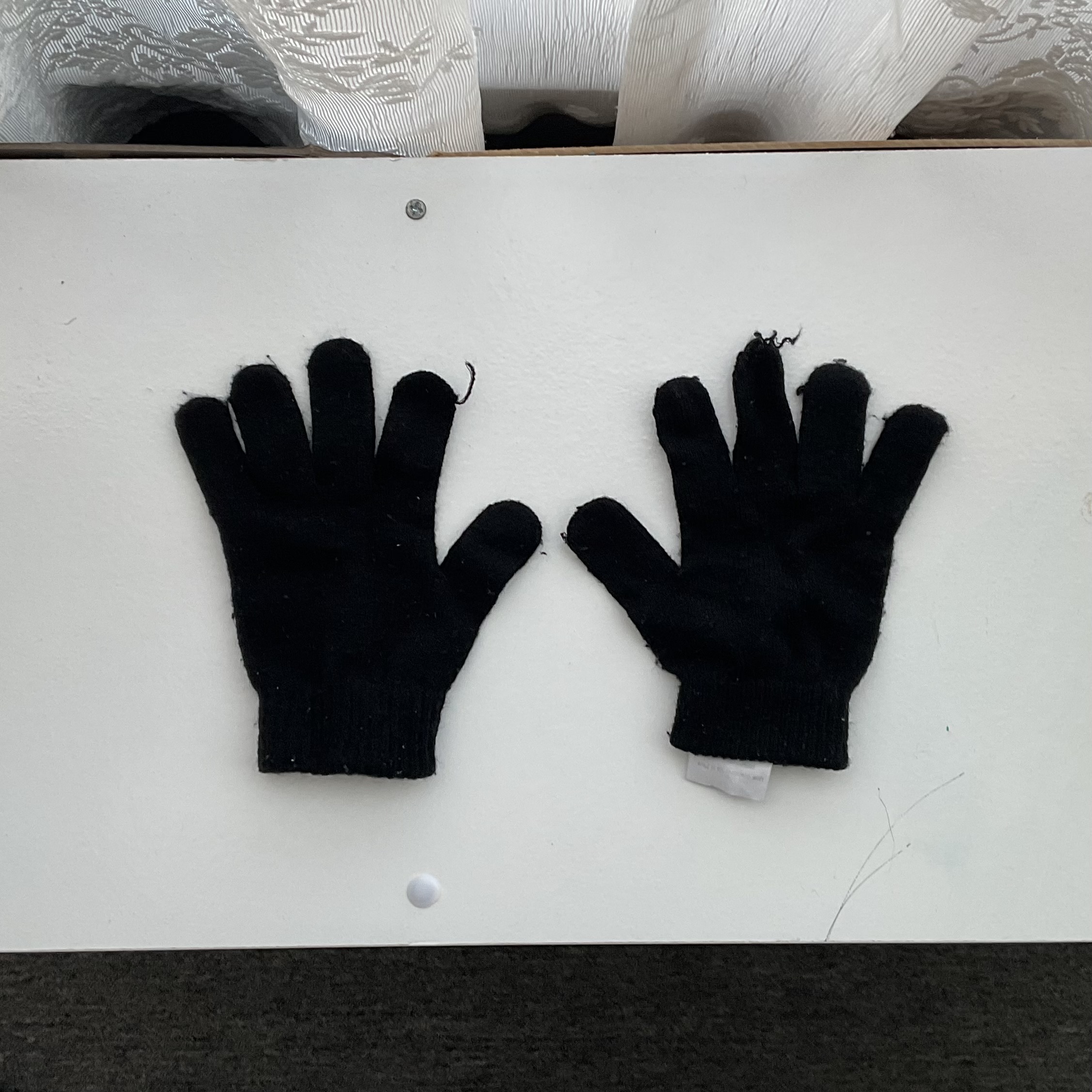 Cotton gloves for a wearable item.