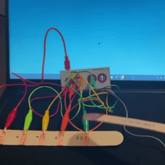 I decided to incorperate all sensors (excluding the 'click' sensor) into the interaction. I used copper tape and wooden popsicle sticks to map out areas where the two sticks would interact. I was going for a wand motion, so when you pressed the tip of one stick to the copper tape areas, it would trigger different sounds connected to the respective sensor.